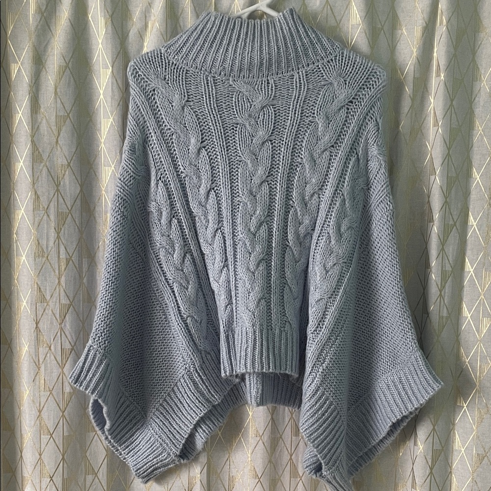 A new day light blue Cable Knit Women’s poncho